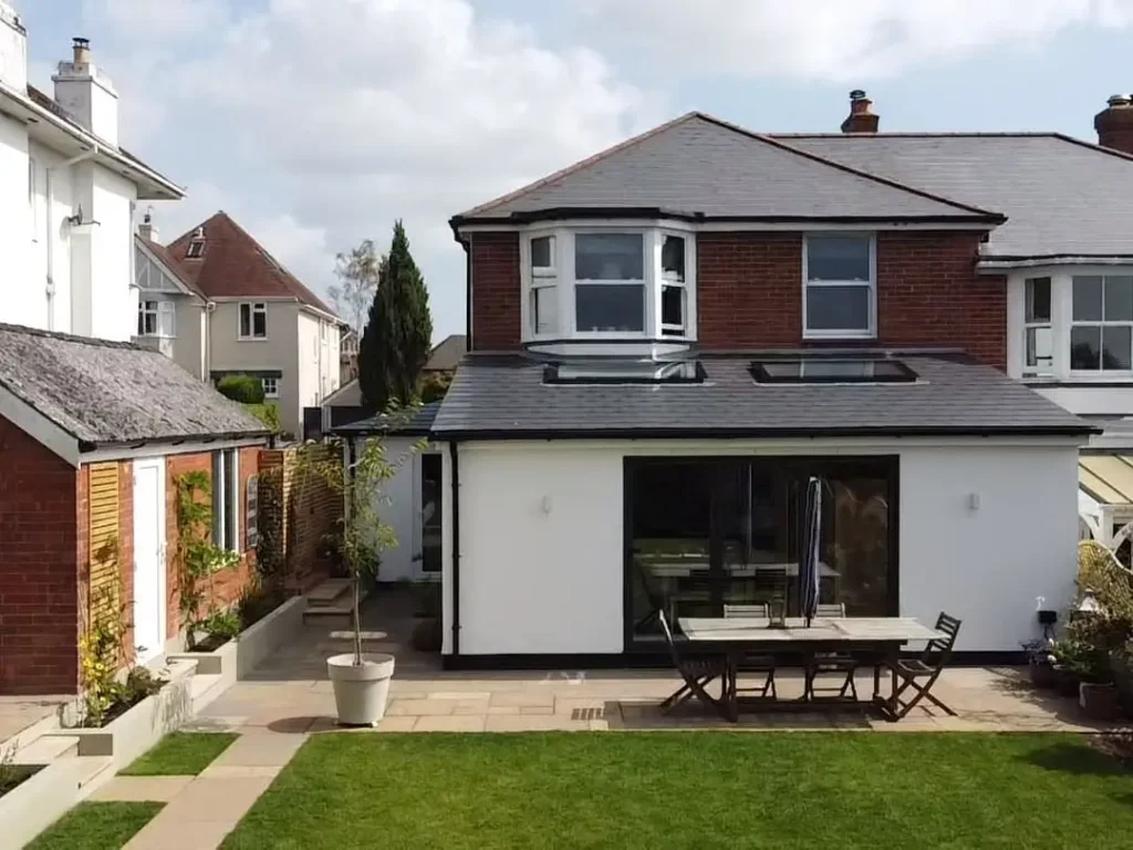 a house with a lawn and a patio