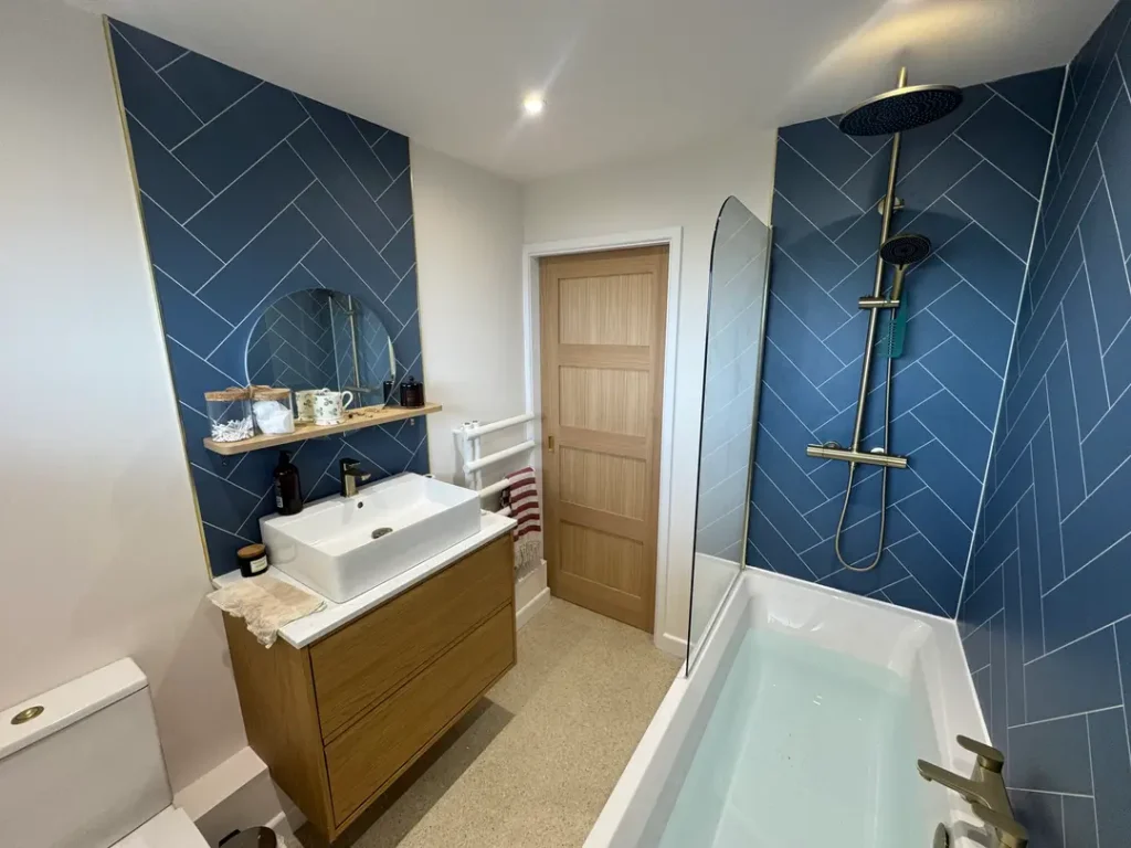 a bathroom with blue tiles