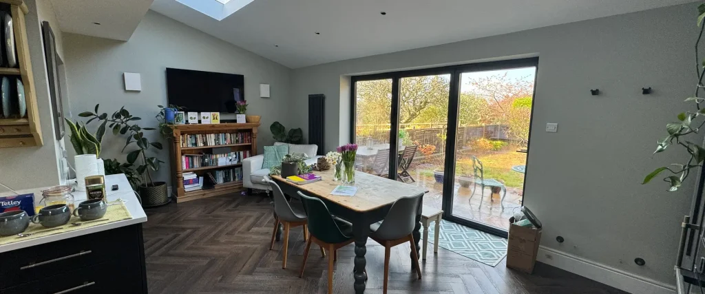 a living room with a table and chairs
