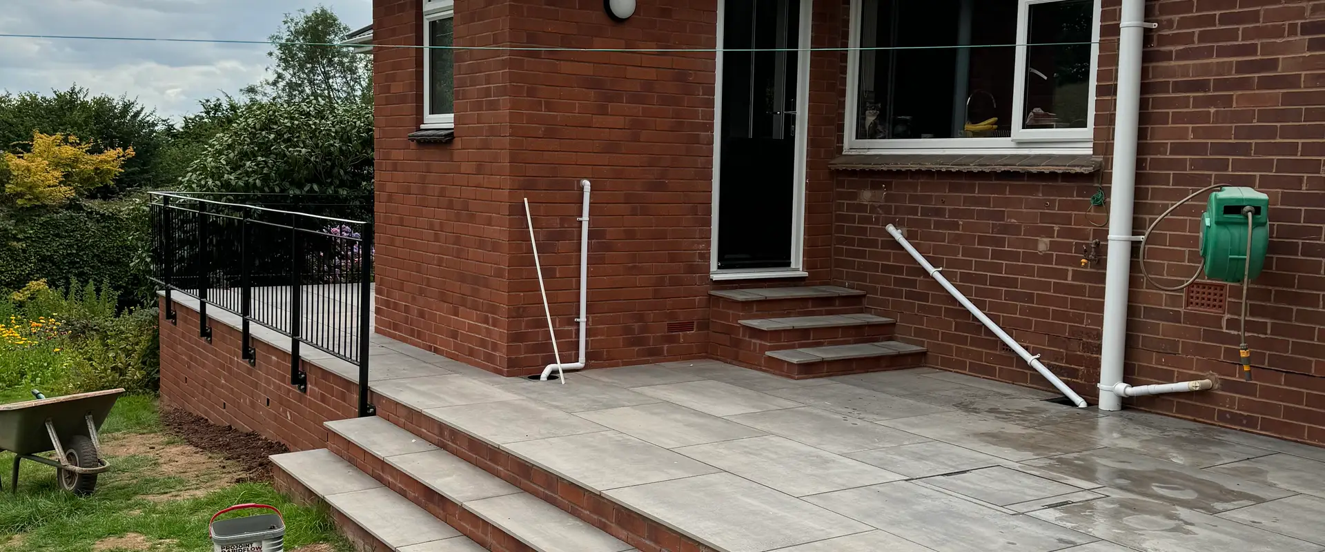 a brick building with stairs and railings